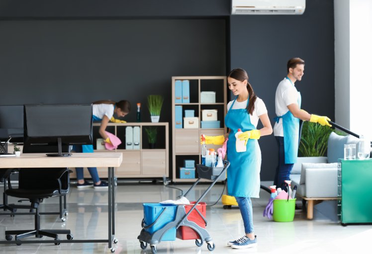 Cleaners working in a modern office